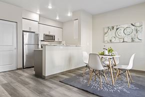 Lacey apartment for rent - A modern kitchen with a dining table set for two.