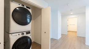 Bend apartment for rent - A white washing machine and dryer in a small room.