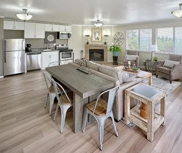 Tacoma apartment for rent - A modern kitchen with a dining table and chairs.