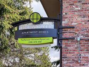 Seatac apartment for rent - A sign for The Hanover Apartment Homes with a phone number and email address.