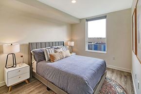 Seattle apartment for rent - a bedroom with a bed and a window