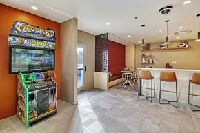 Seattle apartment for rent - a game room with a bar and a slot machine
