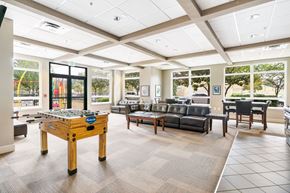 Seattle apartment for rent - a game room with a pool table and couches
