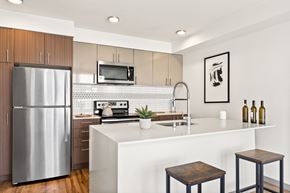 Seattle apartment for rent - a kitchen with an island and two stools