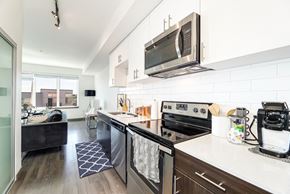 Seattle apartment for rent - an apartment kitchen with stainless steel appliances and a microwave