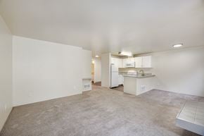 Everett apartment for rent - A spacious living area with a kitchen in the background.