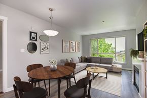 Seattle apartment for rent - a living room with a couch and a table and a window