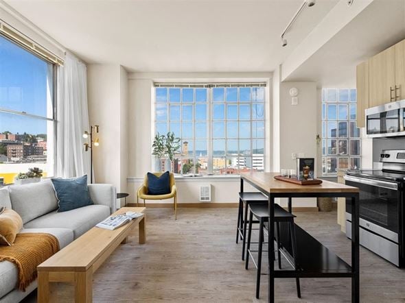 Tacoma apartment for rent - a living room with a couch a table and a window