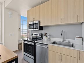 Tacoma apartment for rent - a kitchen with a stove top oven next to a sink