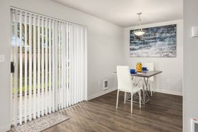 Burien apartment for rent - A dining room with a white table and chairs.