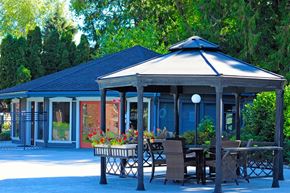 Seattle apartment for rent - a gazebo with a table and chairs in front of a house