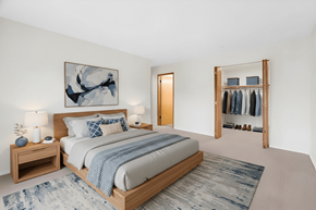 Kent apartment for rent - A bedroom with a large bed and a painting on the wall.