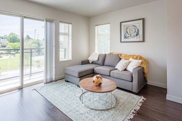 Kirkland apartment for rent - a living room with a couch and a coffee table