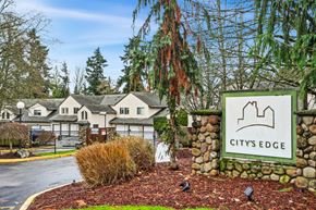 Burien apartment for rent - A sign that says City's Edge stands in front of a building.