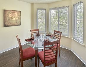 Tacoma apartment for rent - a dining room with a glass table and chairs
