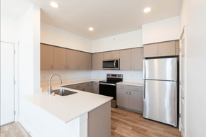 Bend apartment for rent - A modern kitchen with a white countertop and stainless steel appliances.