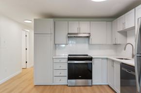 Wilsonville apartment for rent - A kitchen with white cabinets and stainless steel appliances.