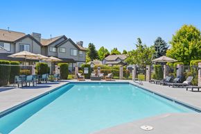 Vancouver townhouse for rent - A large swimming pool in front of a resort.