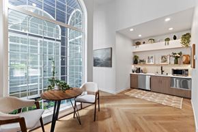 Vancouver townhouse for rent - A modern kitchen with a dining table and chairs.