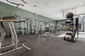 Lacey apartment for rent - A gym with a variety of equipment including treadmills, weights, and exercise machines.