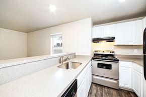 Kent apartment for rent - a kitchen with white cabinets and stainless steel appliances