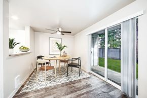 Kent apartment for rent - a dining room with a table and chairs and a sliding glass door