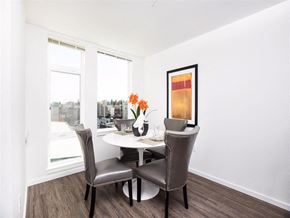 Seattle apartment for rent - A dining room with a table and chairs.