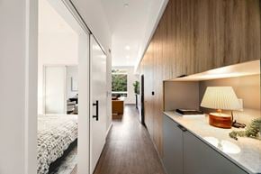 Seattle apartment for rent - A modern bedroom with a bed, desk, and chair.