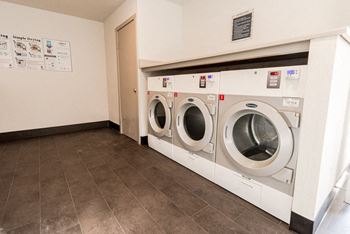 Industrial size washer & dryer room