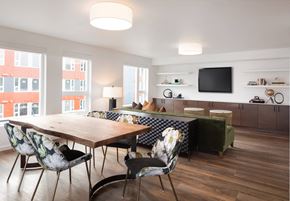 Seattle apartment for rent - A modern dining room with a wooden table and chairs.