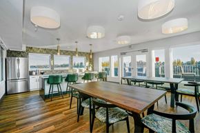 Seattle apartment for rent - A dining room with a wooden table and chairs.