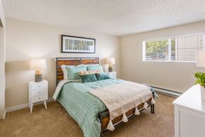 Kenmore apartment for rent - a bedroom with a bed and a window