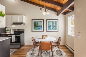 Kenmore apartment for rent - a kitchen and dining room with a table and chairs