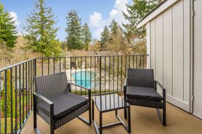 Kenmore apartment for rent - a balcony with two chairs and a pool