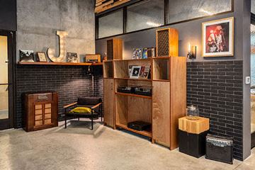 Seattle apartment for rent - a living room filled with furniture and a brick wall