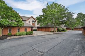 Williamsville condo for rent - A residential area with houses and trees.