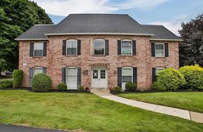Amherst townhouse for rent - A red brick house with a white door and windows.