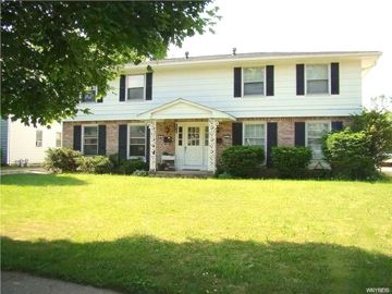Amherst apartment for rent - A white house with a porch and a white door.