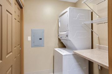 Amherst apartment for rent - A white dishwasher and dryer in a small kitchen.
