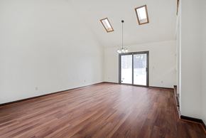 Amherst house for rent - A room with wooden flooring and a chandelier.