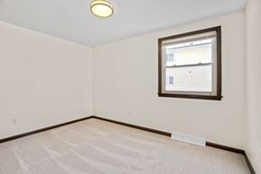 Amherst apartment for rent - A room with a window and carpeted floor.