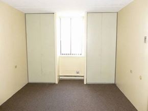 Buffalo apartment for rent - A room with a window and a radiator on the wall.