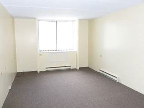 Buffalo apartment for rent - A room with a window and a radiator on the wall.