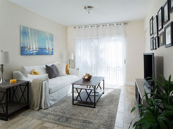 Miami apartment for rent - a living room with a couch and a table