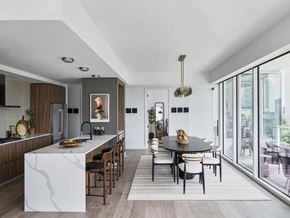 Dallas apartment for rent - A modern kitchen with a dining table and chairs.