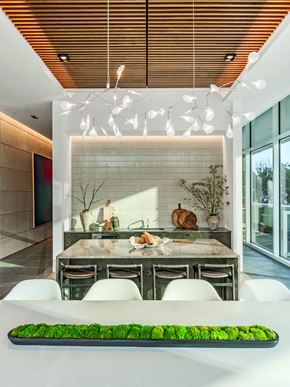 Dallas apartment for rent - A modern dining room with a long table and chairs.