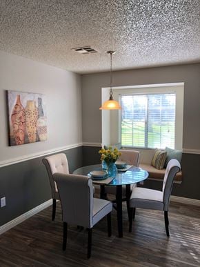 Las Vegas apartment for rent - a dining room with a table and chairs and a window