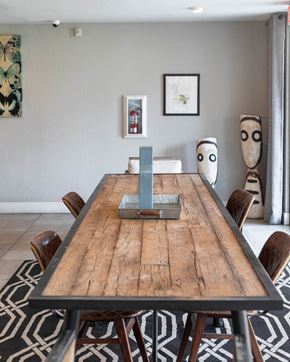 Las Vegas apartment for rent - a dining room table with a remote control on it