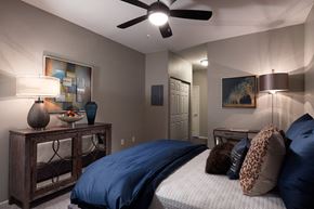 Kansas City apartment for rent - City Place at Westport Fully Furnished Bedroom with Plush Carpet Flooring, Ceiling Fan, and Large Closet