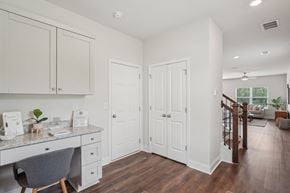 Cartersville townhouse for rent - The entrance to the Aberdeen home featuring rich hardwood-style flooring and crisp white walls.